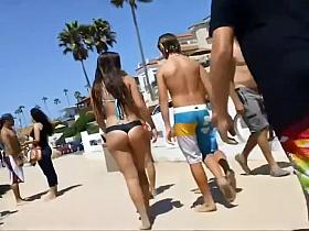 Following girls in thong bikinis to beach