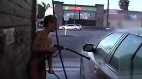 Hot blonde looker with big tits washes a car in the nude