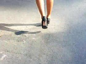black girl legs in mini shorts and heels