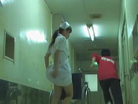 Man is pulling up nurse dress and pinching her booty