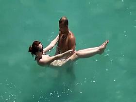 He teaches her how to swim