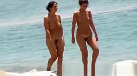 Two girls naked at beach