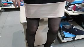 My baby flashing stockings in a shoe market