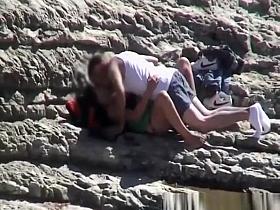 Couple spied fucking in rocky beach