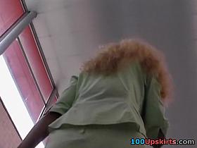 Looking up petticoat of a business lady
