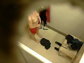 Hidden camera in changing room gets naked brunette
