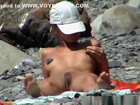 Skinny nudist woman sunbathing