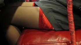Black stockings with red tops under table