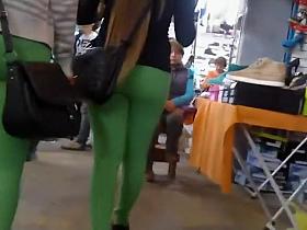 Two asses in tight green leggings