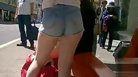 Beauty with great buttocks waits for the bus