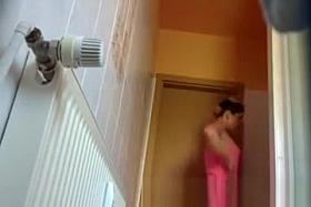 Stunning wife gets ready to shower