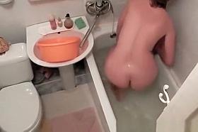 Woman spied in bathtub washing body