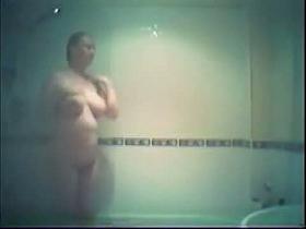 Buxom blonde chubster caught on a hidden shower cam