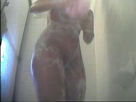 Hidden shower videos show a hot bodied chick soaped up.