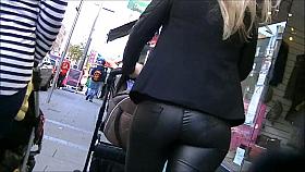 Candid ass in shiny tight leather pants
