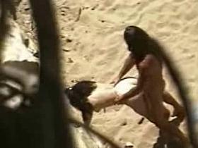 Horny couple fucks in a voyeur sex on the beach video