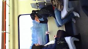 Girl in black tights and flats on train