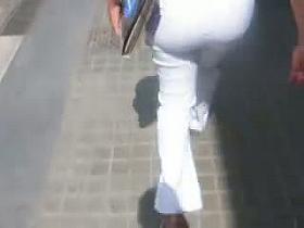 Hot street candid video of a mature women in white pants