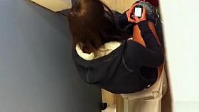 Girl spied over the toilet wall peeing