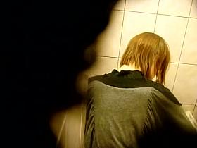 Skinny redhead with short hair, shows ass and takes a piss on a toilet