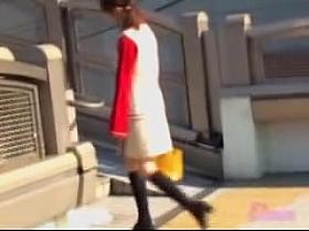Girl in a white dress with red sleeves got skirt sharked