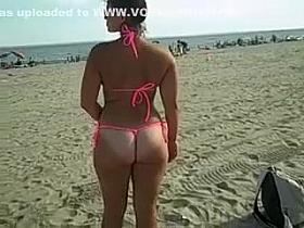 Girl Shows Her Pussy and Ass in Tight Bikini at the Beach
