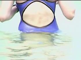 Sea water is petting the body of candid bikini fem 07w