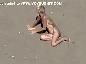 Dirty nudist girl on the beach
