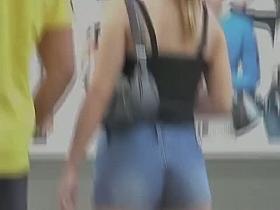 Candid street videos feature hot booties in shorts.