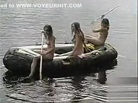Naked teens go boating on the lake
