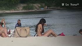 Beach voyeur video of shy topless girl sunbathing