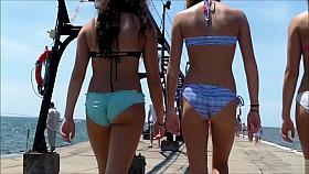 British coed girls on a vacation wear tight bikinis to the beach