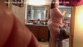 Fat mature woman doing her hygiene