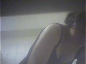 Amateur girl hiding nudity under lingerie on shower cam