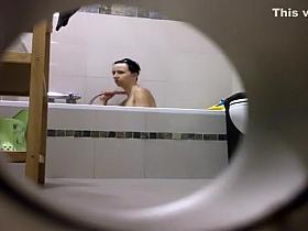 Peeping on her shower through a hole