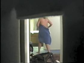 Spy cam scenes with topless girl in the hotel room