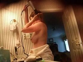 Amateur wife drying hair