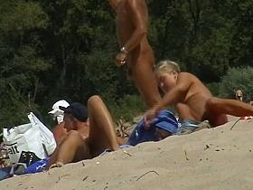 Lusty naked girl caught on cam by a horny beach voyeur.