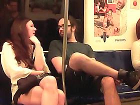 Hot redheaded chick gets seduced by a nerdy dude on the tra