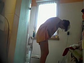 Woman wiping off after a shower