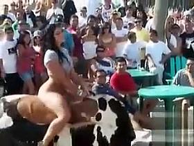 Chubby hoochie rides an electronic bull in her G-strings