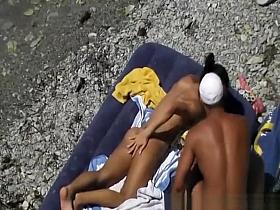 Nudist fucked in air mattress in beach