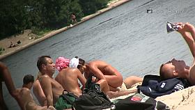 Another full of people nude beach with many babes to watch