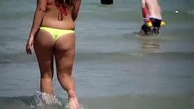 Sexy thick brunette in thong at beach