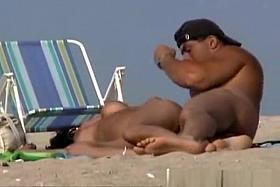 Flirt on a Nudist Beach