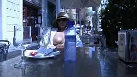 Milf plays with tits and pussy in public