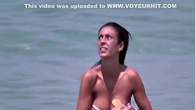 Brunette at the beach filmed as she provides pure beauty