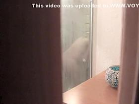 Girl shaves her pussy in the shower