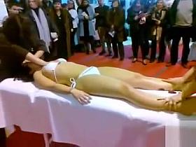 Double massage in public of an Asian bikini girl