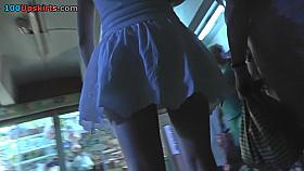 Skinny ass and g-string of an auburn gal in upskirt mov